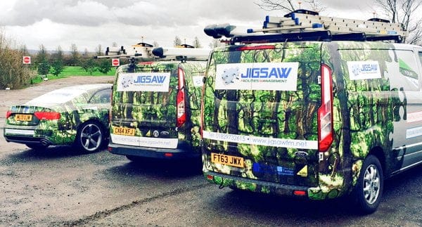 Jigsaw FM Vans and car lined up in company livery