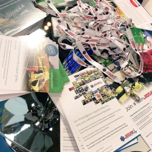 Custom flyers and lanyard printing on exhibition table