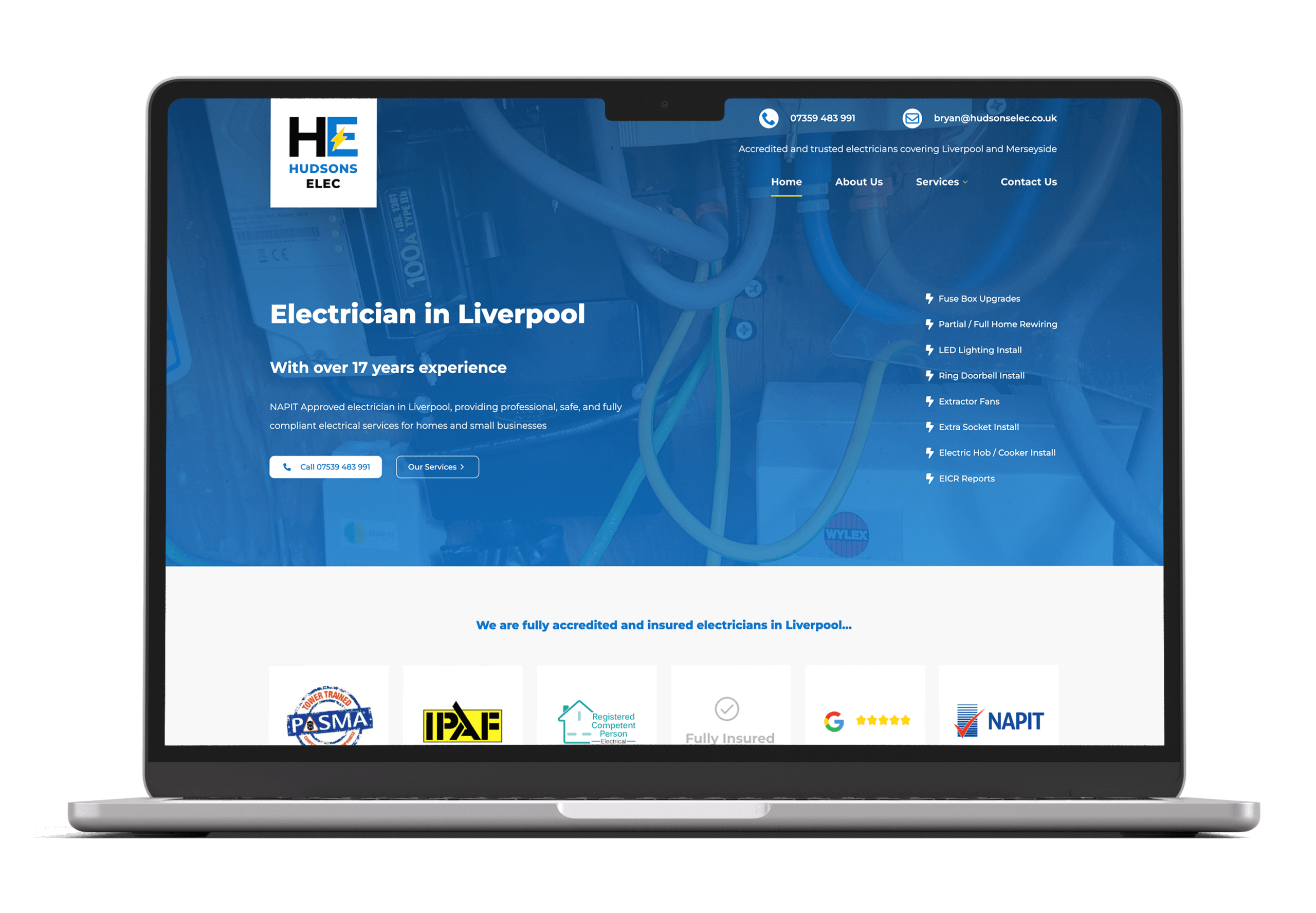 HudsonsElec homepage design on Macbook screen